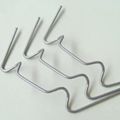Set of metal spring clips with bent wire design on white background